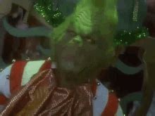 Like marshmallow pops and cookies. . Grinch eating onion gif